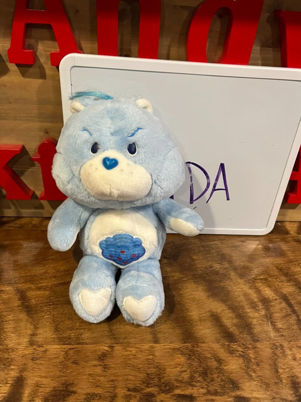 vintage 1983 Kenner Care Bears Grumpy Bear plush toy.